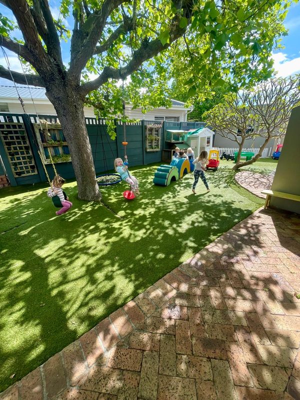 Children playing in the garden at Little Owls Playschool